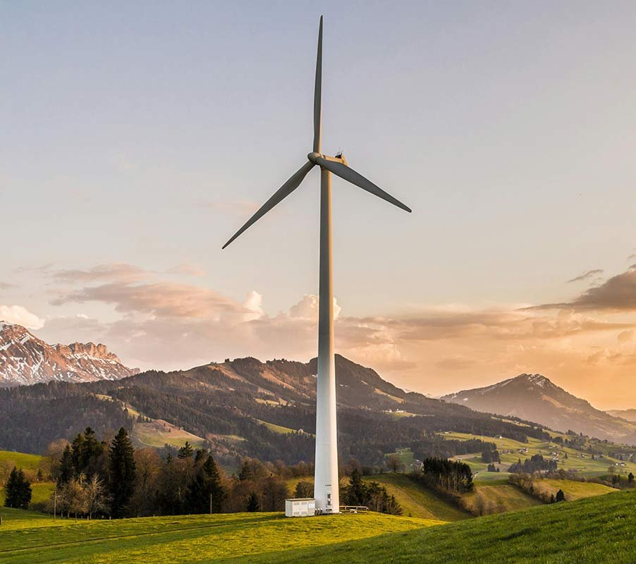Building a sustainable future: Eco-Friendly practices for factories wind turbine between hills